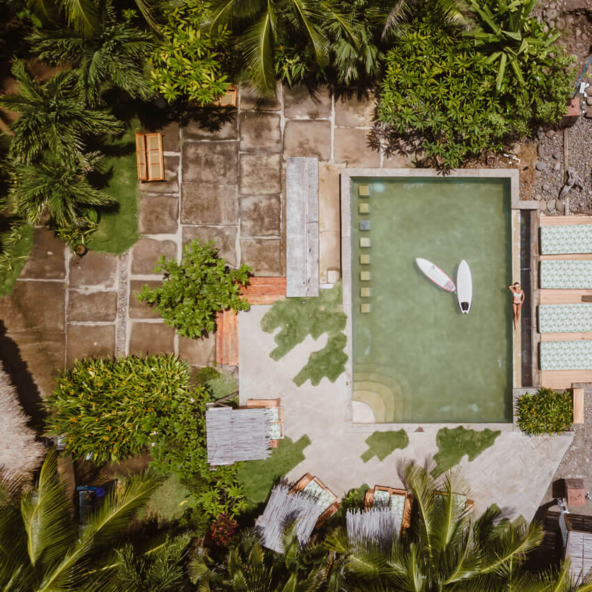 Aerial view of pool with surfboards