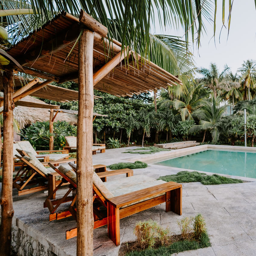 deck with seating poolside at women's retreat