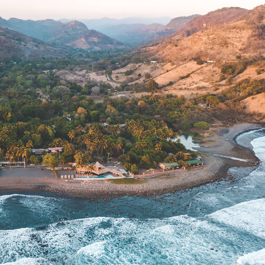 aerial view of womens retreat with El Salvador mountains in background