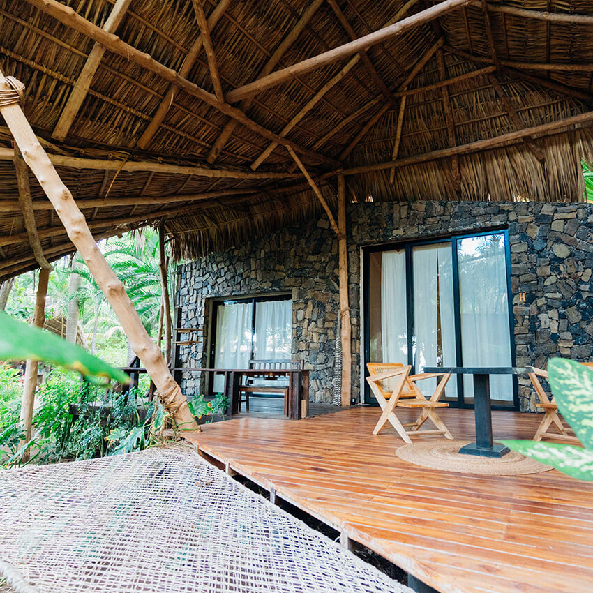 Spacious lanai for outdoor dining and lounging at the Private Jungle Bungalow at the women's Phoenix Retreat in El Salvador